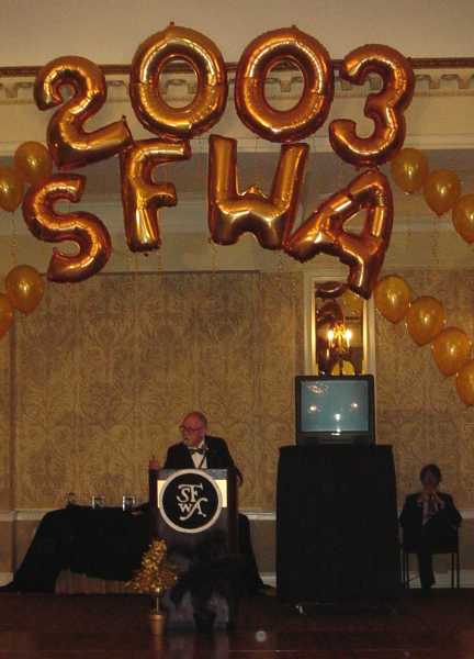 Toastmaster Harry Harrison Under the SFWA Arch 