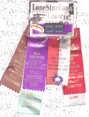 LoneStarCon badge with ribbons for committee, Timebinders, program participant, Alamo and Emergency Holographic Texan